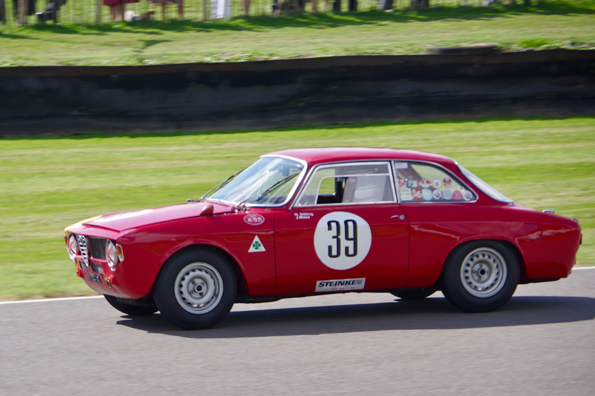 A 1965 Alfa Romeo Giulia Sprint GTA competing at the 2018 Goodwood Revival.